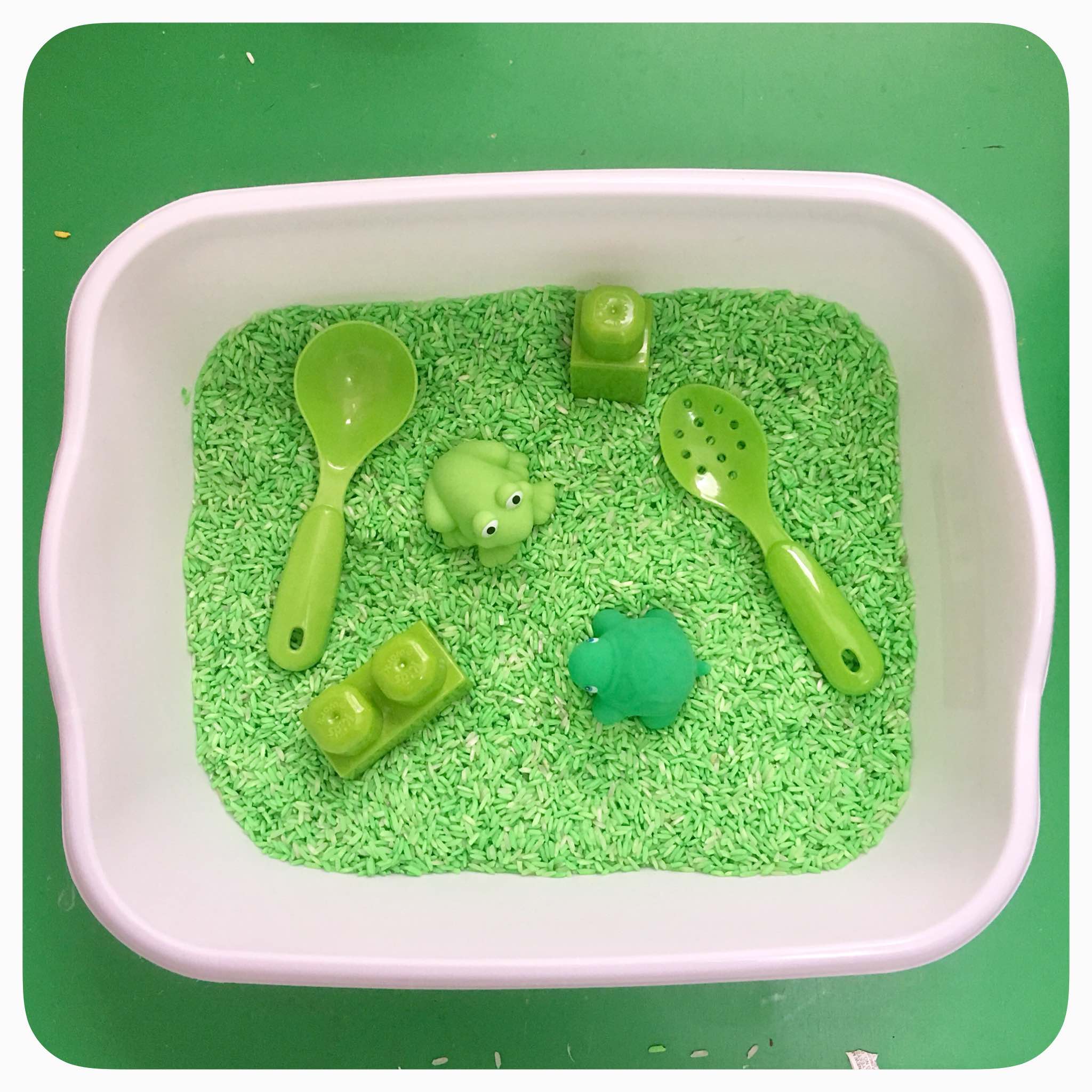 Toddler Sensory Bin - Amazing how much play kids can get out of such simple sensory materials. Acrylic paints to dye the rice .