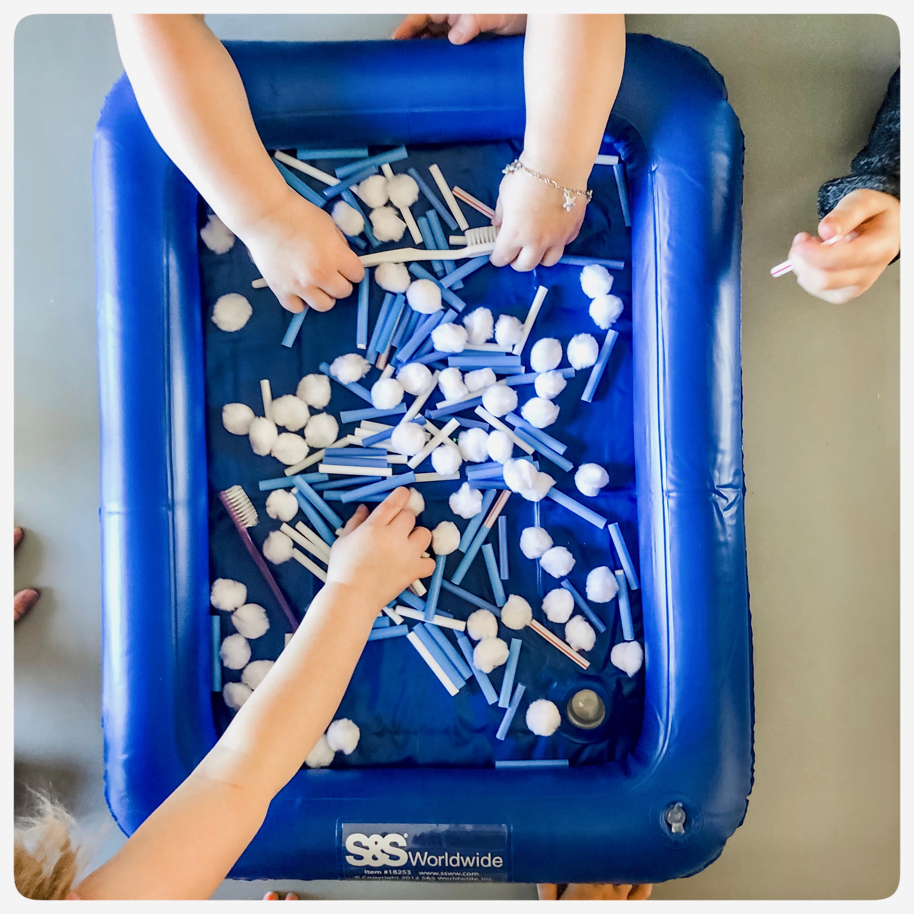 Dental Health 🦷. This sensory bin was such a hit. I filled with cut up blue and white straws, some cotton balls and toothbrushes. 