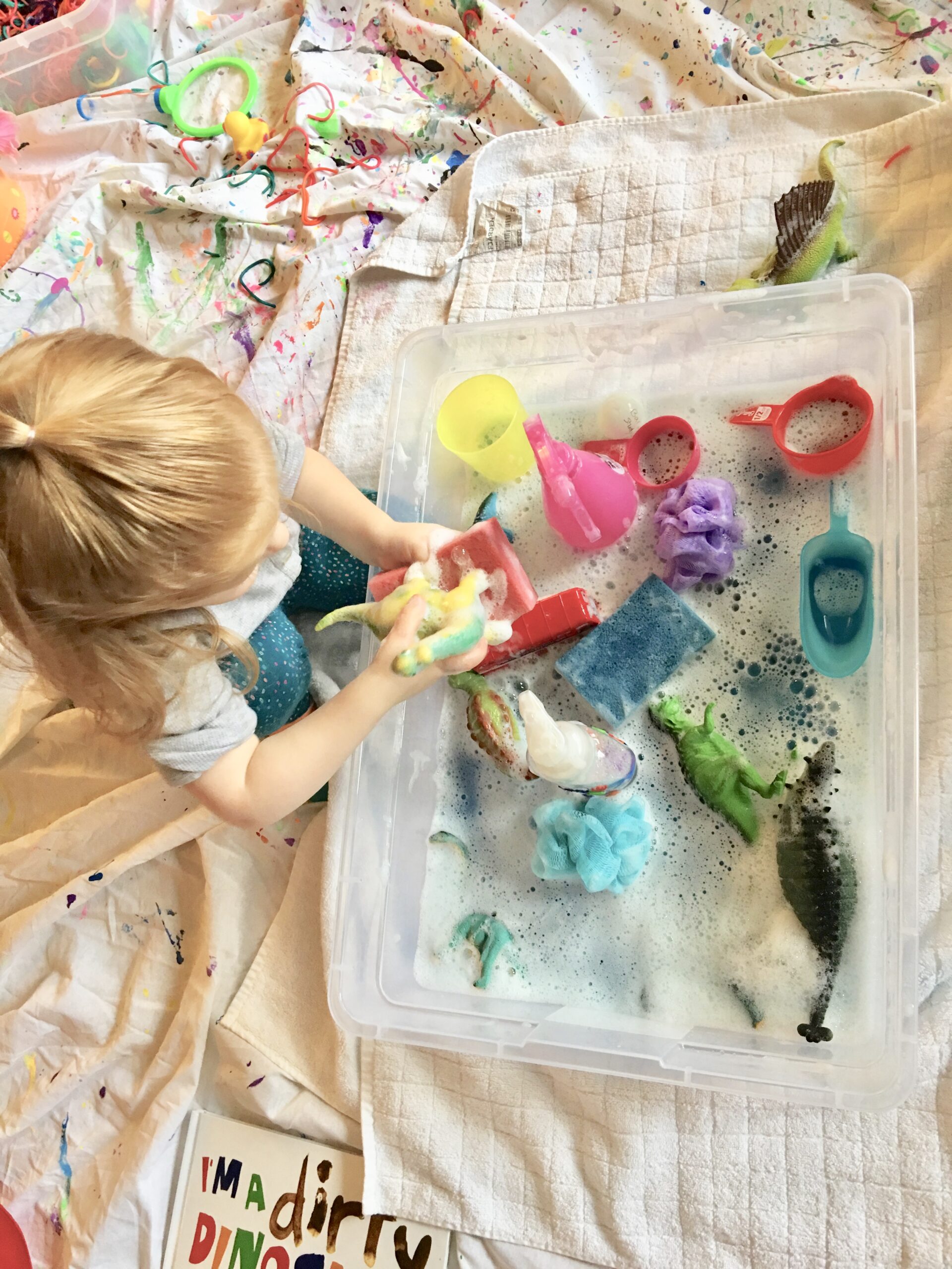 Starting out by reading I'm a Dirty Dinosaur then enjoying some simple and fun sensory bin by cleaning of your own dinosaurs.